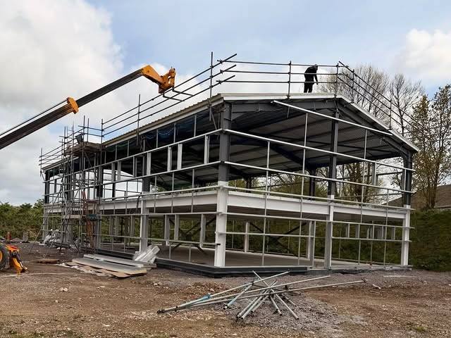 Steel frame of a two-storey industrial unit ready for roof and wall cladding